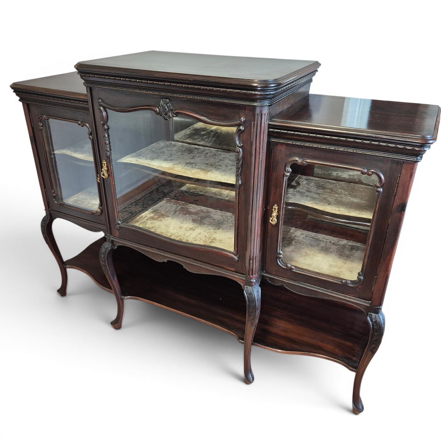 Antique mahogany display cabinet with mirrored interior and brass handles