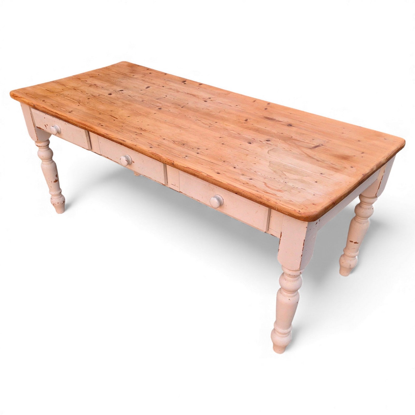 Long farmhouse table with storage drawers along one side