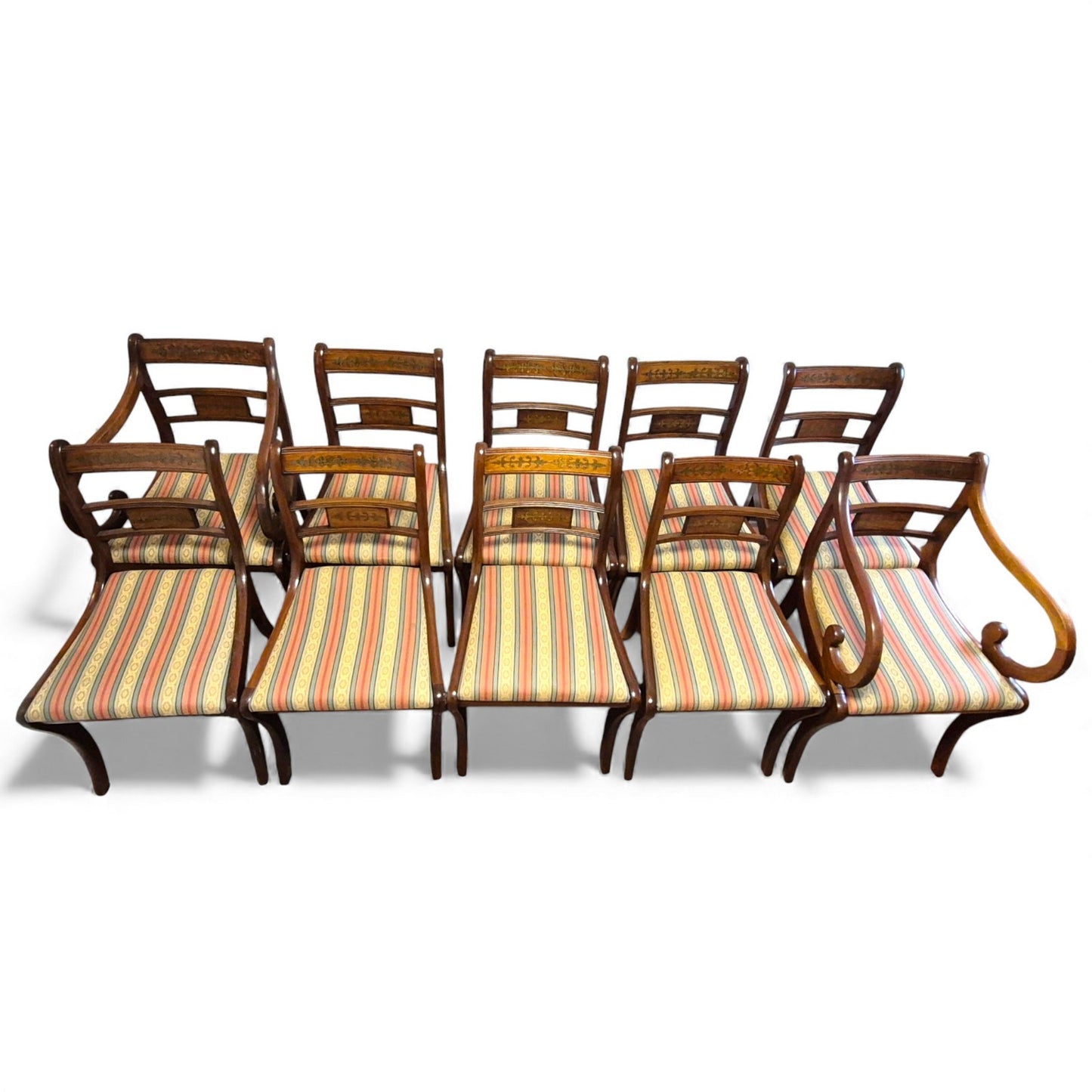 Mahogany Regency style dining chairs in classic striped fabric