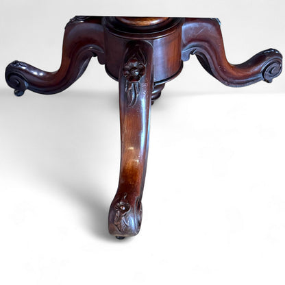 Ornate carved pedestal base on Victorian mahogany tilt-top table – antique craftsmanship detail