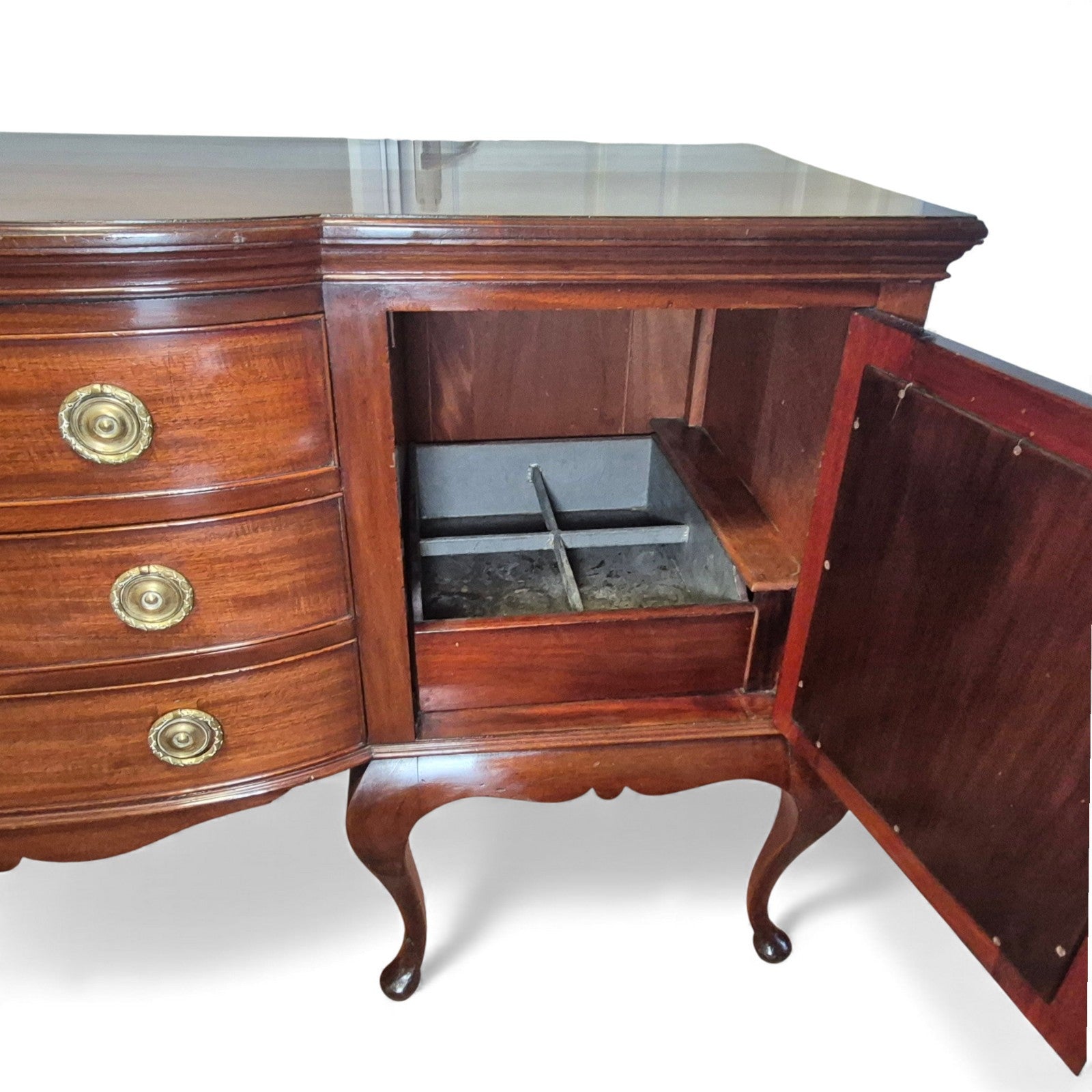Interior of cupboard with shelves and metal-lined compartment