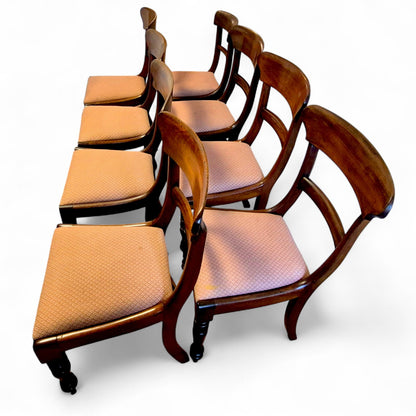 Side view of antique mahogany dining chairs with reupholstered seats (2022)