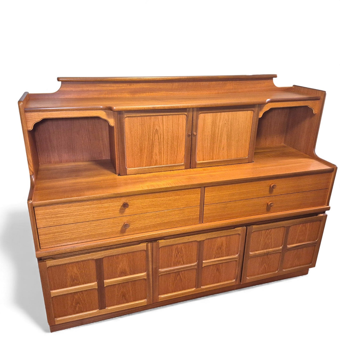 Angled view of mid-century teak sideboard showing two-tier design