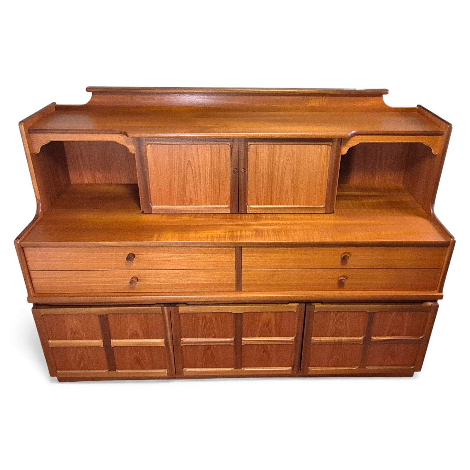 Nathan Mid-Century teak dresser with sculpted doors and upper shelves