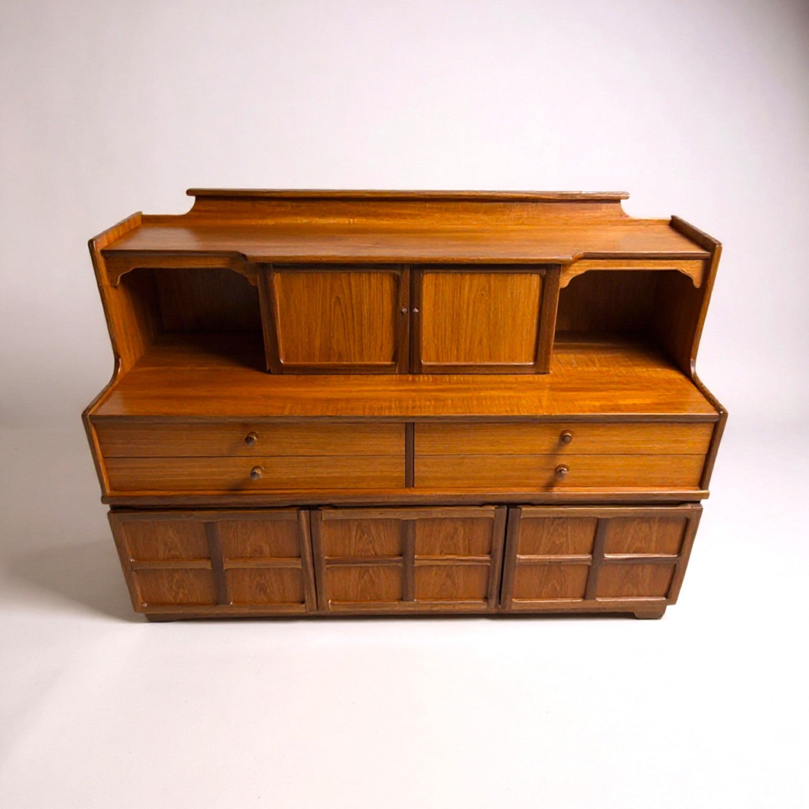 Large Nathan teak dresser with sculpted doors and upper shelves