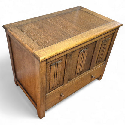 Mid-century oak blanket chest with rich grain and warm patina