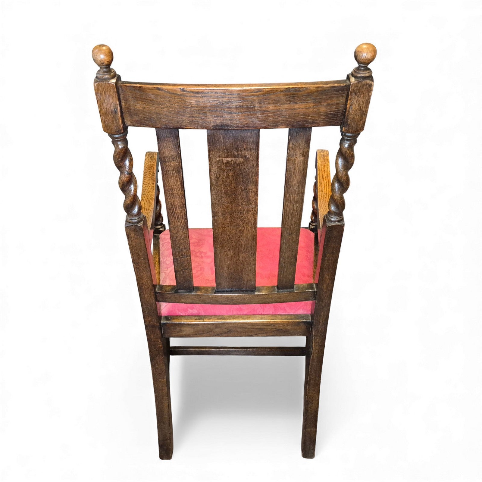 Back view of carved oak hall chair with fan-crest panel