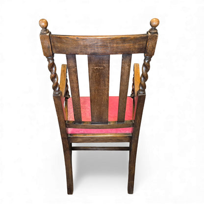 Back view of carved oak hall chair with fan-crest panel