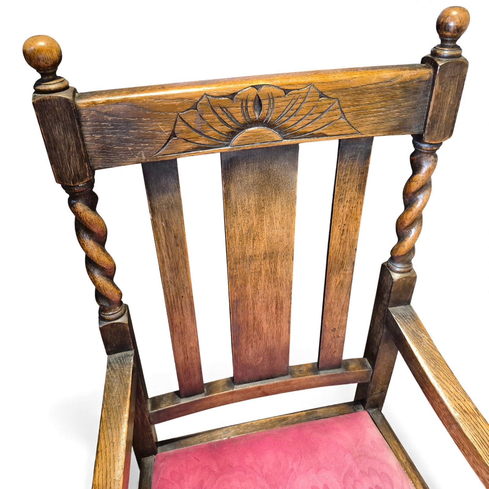 Detail of carved fan-crest top rail on vintage oak chair