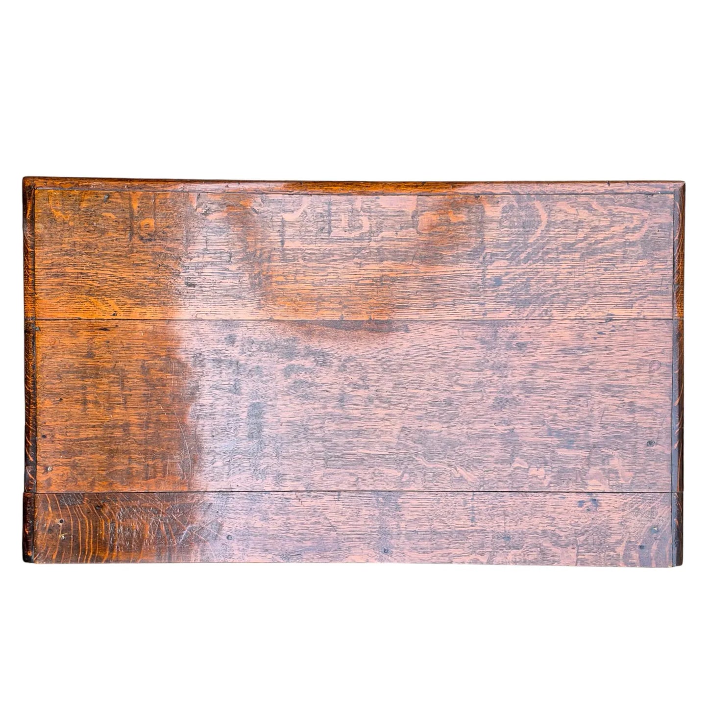 Plank top of antique oak side table showing natural wear, grain, and warm oak tone.