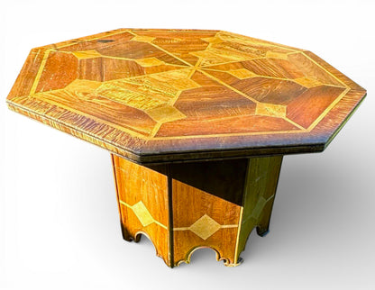 Octagonal top of mid-century Danish walnut dining table with marble inlay