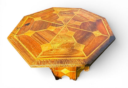 Octagonal top of mid-century Danish walnut dining table with marble inlay