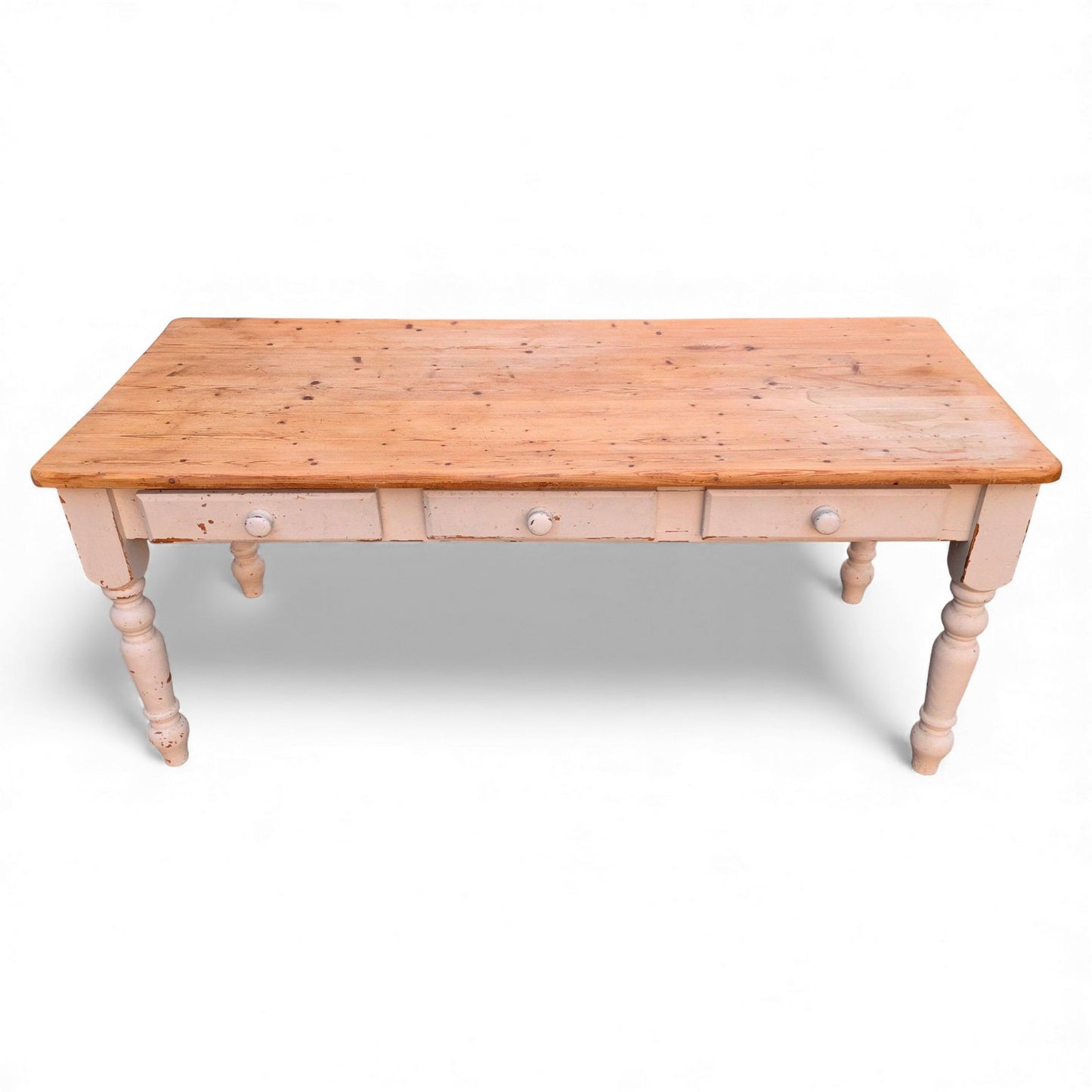 Rustic pine kitchen table with three drawers and turned legs