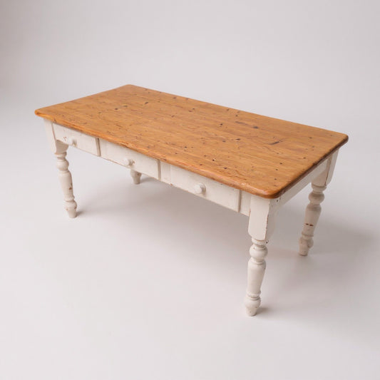Pine farmhouse kitchen table with aged plank top and painted base