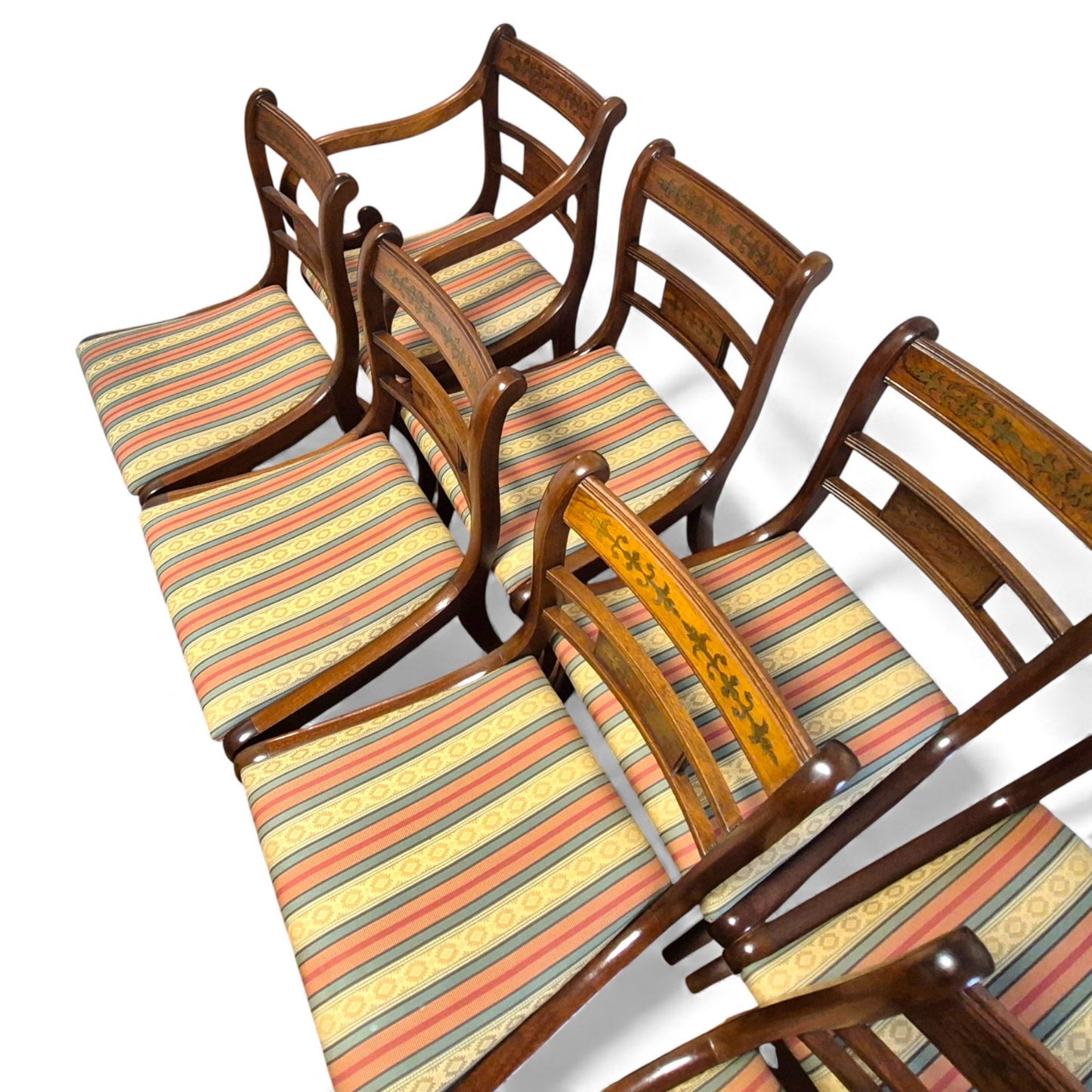 Regency style mahogany dining chairs with brass inlay