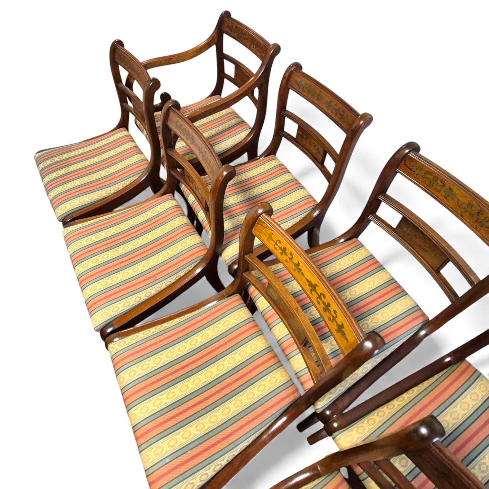 Regency style mahogany dining chairs with brass inlay