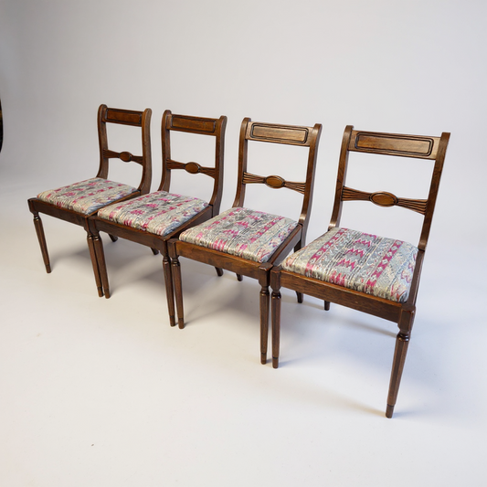 Set of four Regency style dining chairs with carved oval backs offered for re-upholstery