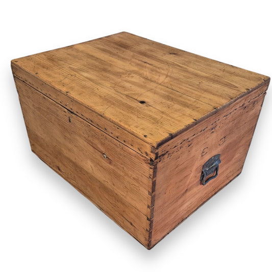 Side detail of rustic 19th century pine trunk with traditional dovetail joinery