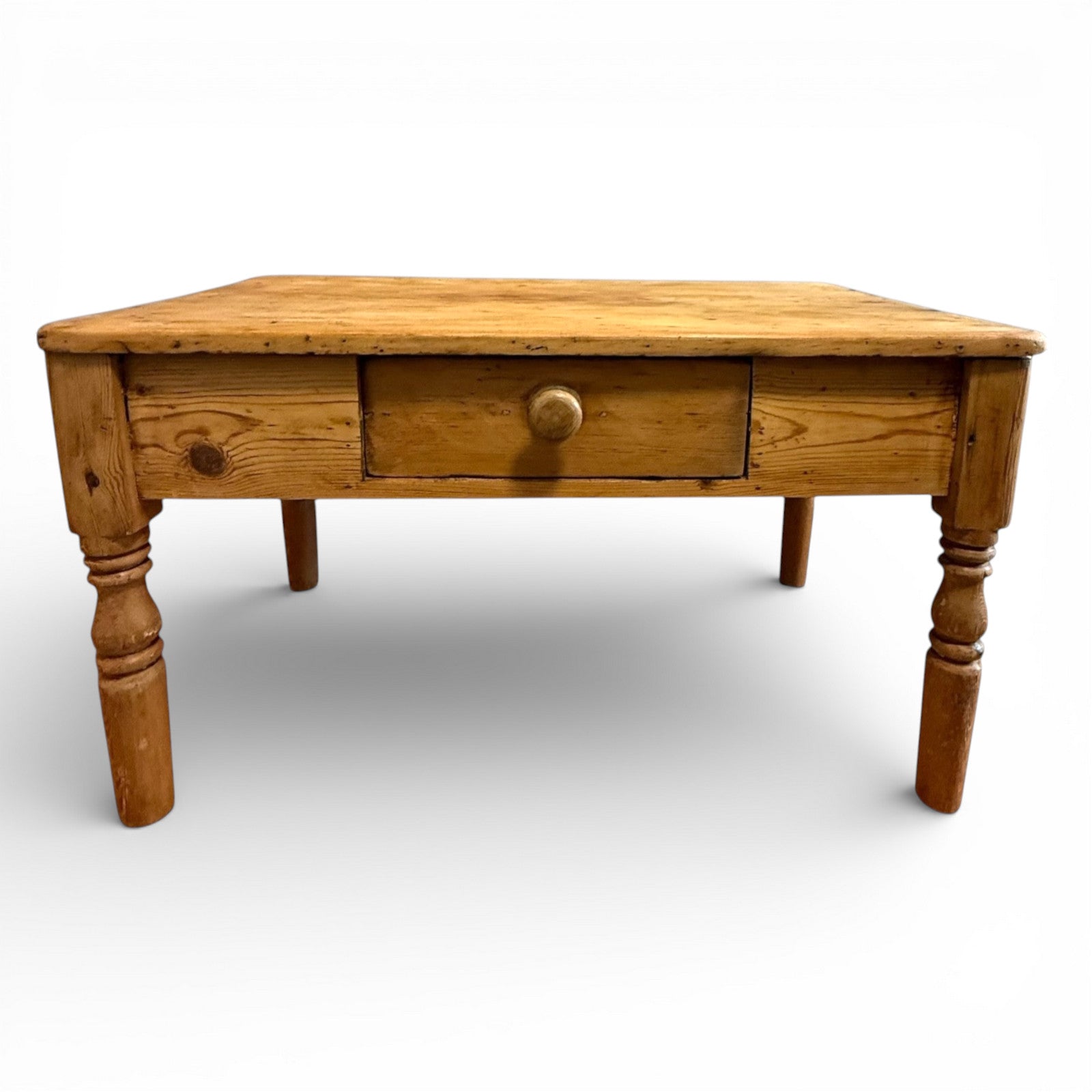Rustic square coffee table crafted from solid pine with visible grain detail