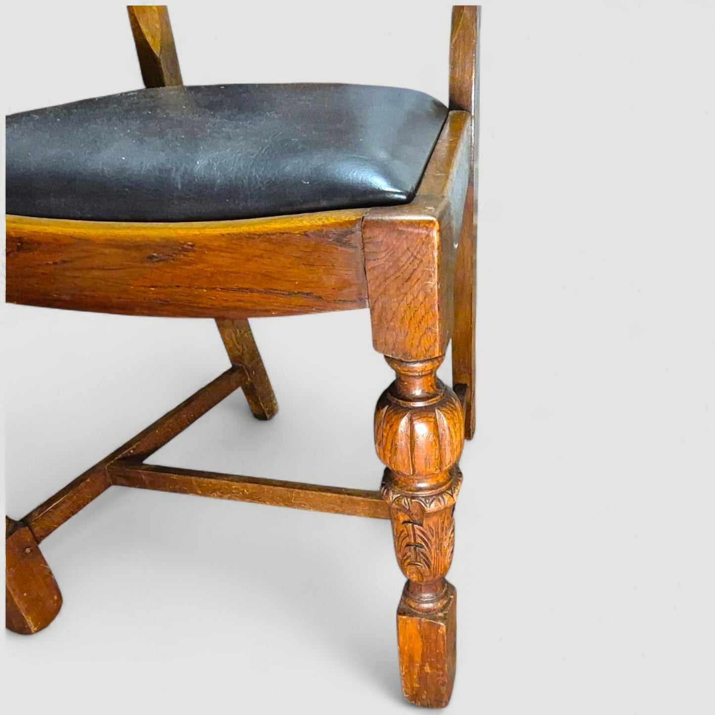 Set of 4 Vintage 1920s Honey Oak Dining Chairs – Carved Detail & Black Upholstered Seats