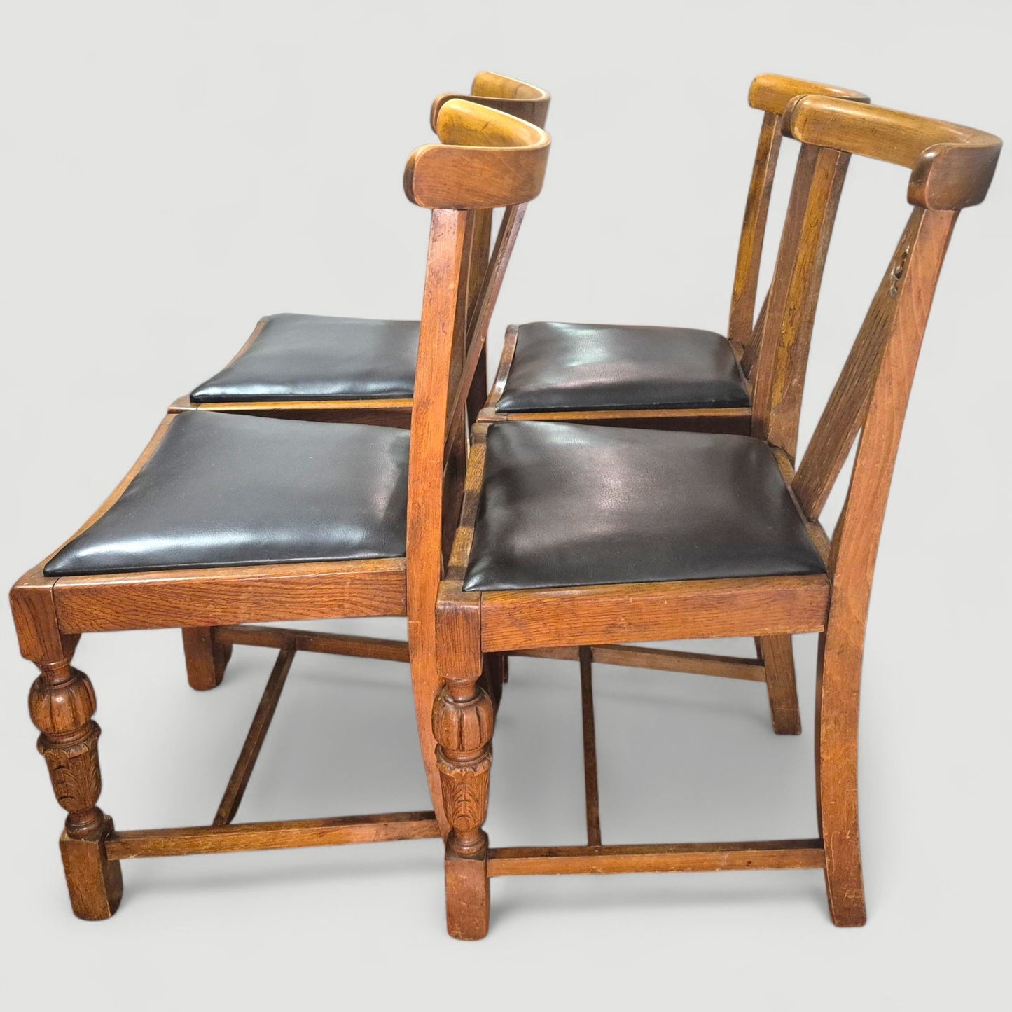 Set of 4 Vintage 1920s Honey Oak Dining Chairs – Carved Detail & Black Upholstered Seats