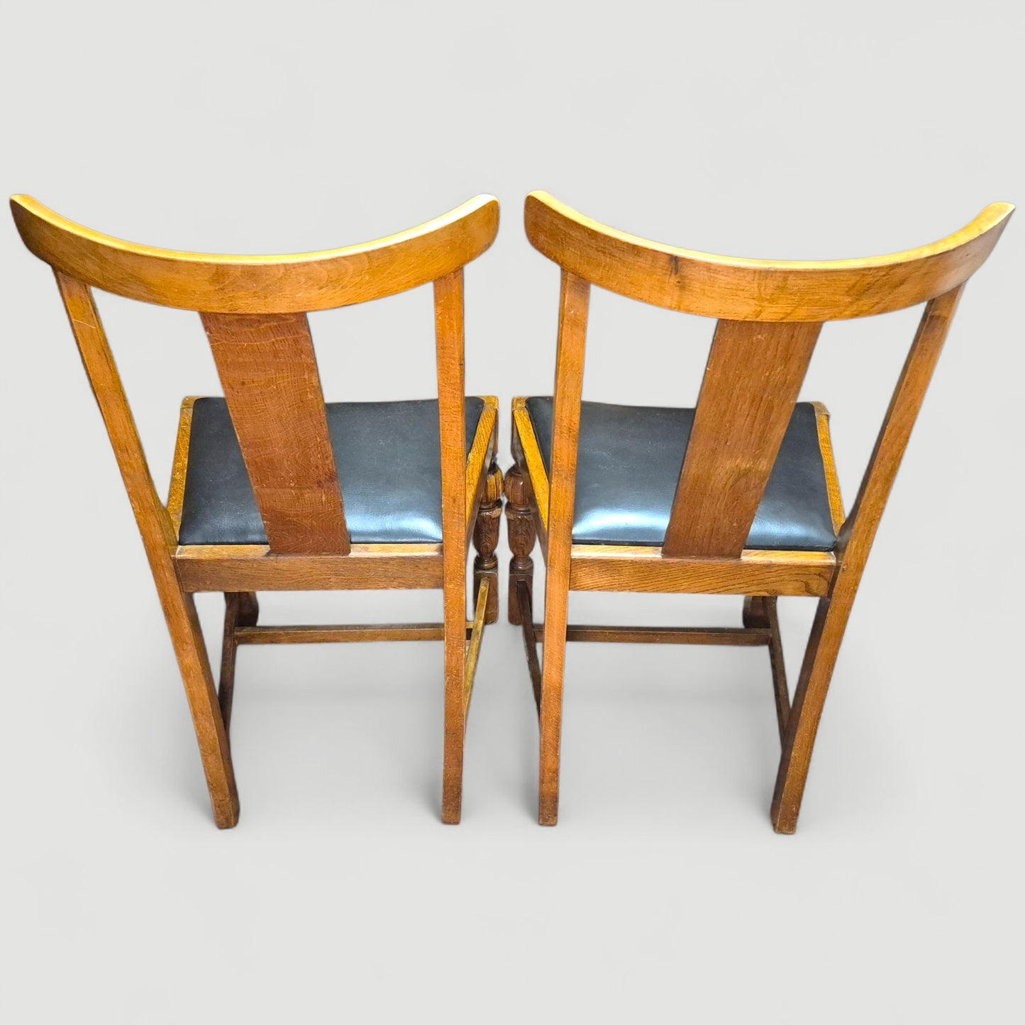 Set of 4 Vintage 1920s Honey Oak Dining Chairs – Carved Detail & Black Upholstered Seats