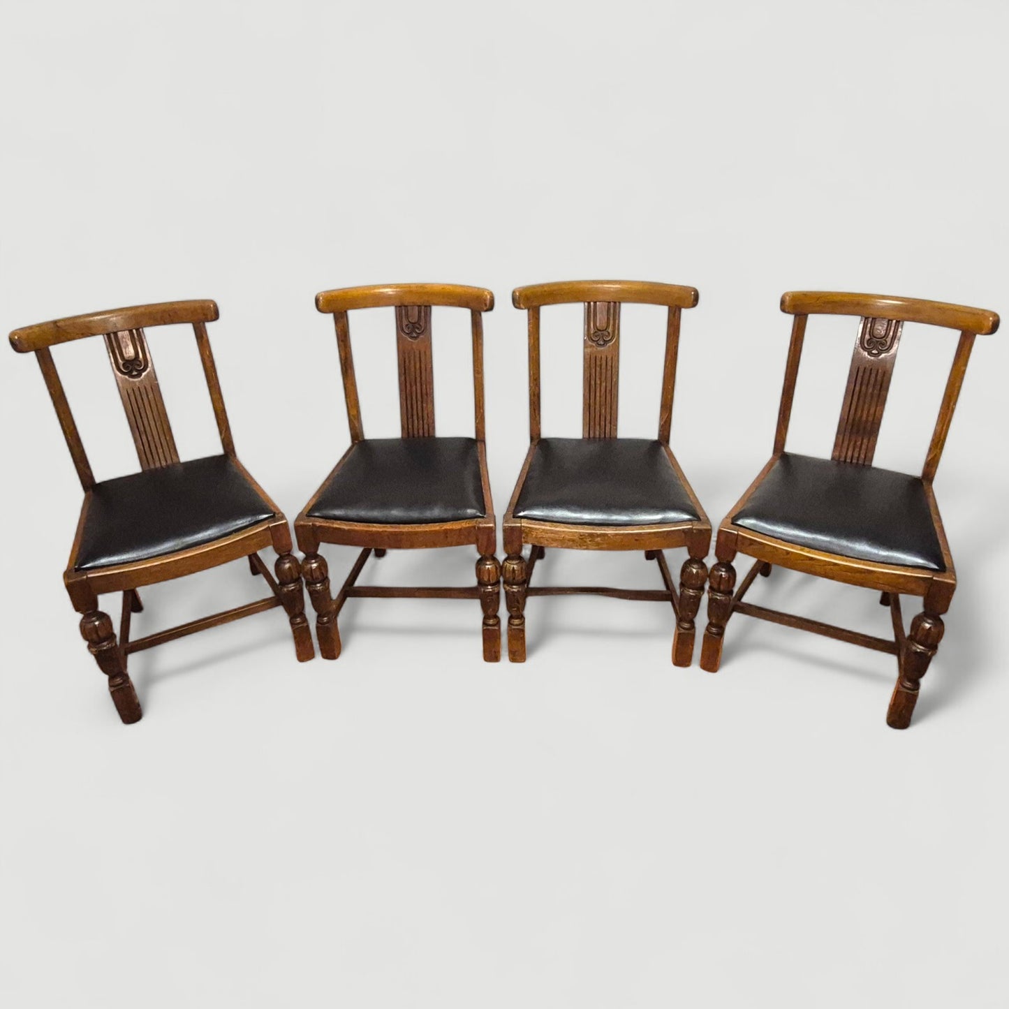 Set of 4 Vintage 1920s Honey Oak Dining Chairs – Carved Detail & Black Upholstered Seats