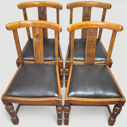 Set of 4 Vintage 1920s Honey Oak Dining Chairs – Carved Detail & Black Upholstered Seats