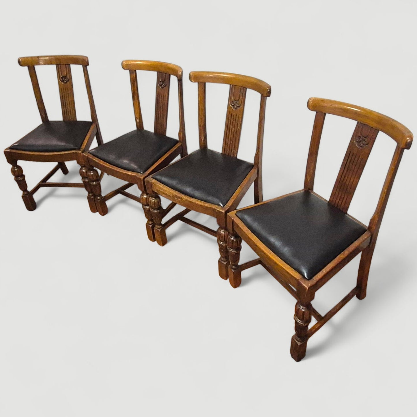Set of 4 Vintage 1920s Honey Oak Dining Chairs – Carved Detail & Black Upholstered Seats