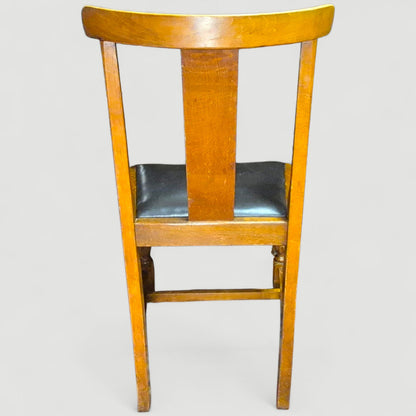 Back view showing craftsmanship and grain of 1920s oak dining chairs