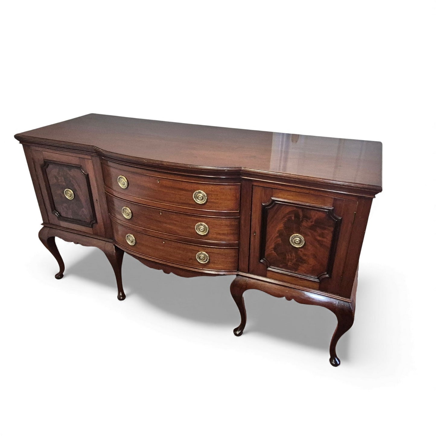 Side view of antique serpentine sideboard showing curved profile