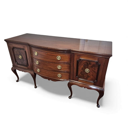 Side view of antique serpentine sideboard showing curved profile