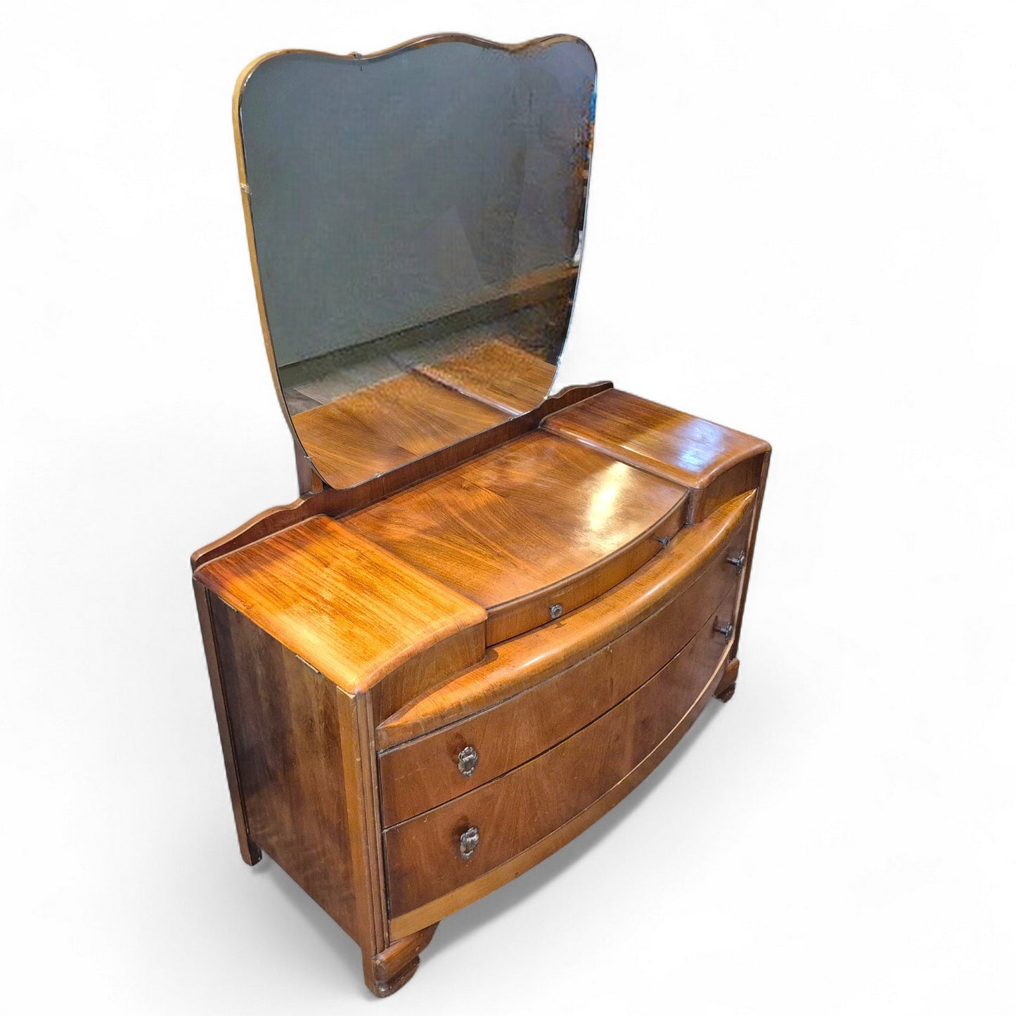 Side angle view of Art Deco dressing table showing walnut veneer grain and mirror shape