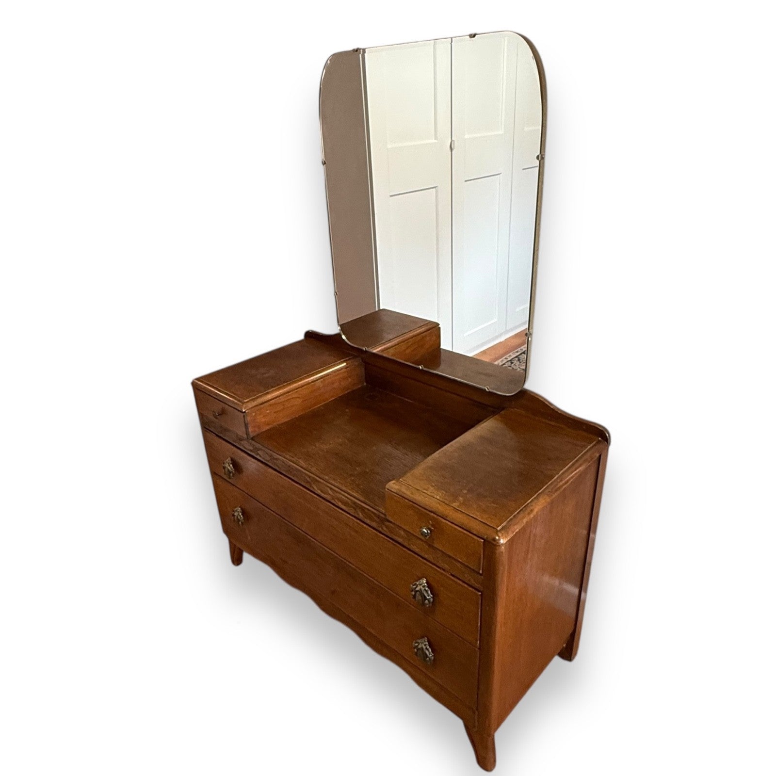 Right side view of mid-century oak dressing table with drawers and mirror