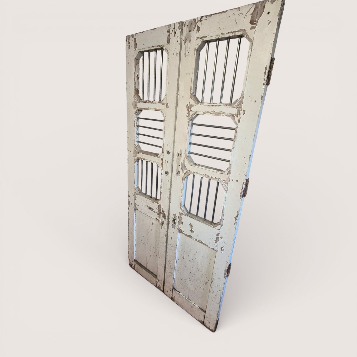 Tall indian jali timber doors with stainless steel bars