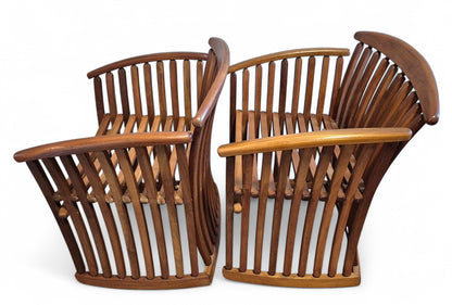 Side view of bentwood steamer armchair showing sculptural curved wood construction