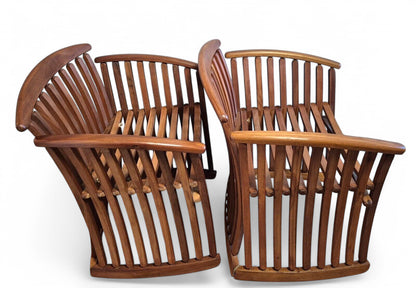 Side view of bentwood steamer armchair showing sculptural curved wood construction