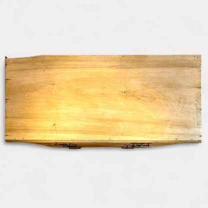 Top surface of antique pine chest showing age-related wear and marks