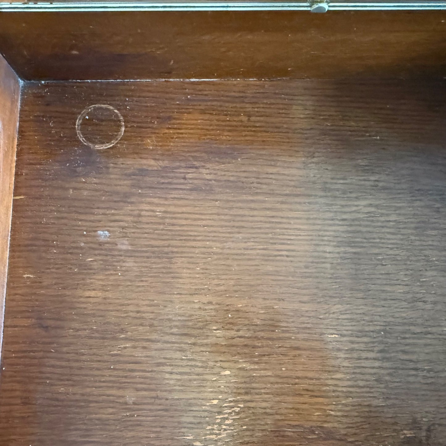 Top surface of Harris Lebus oak dressing table showing wear mark