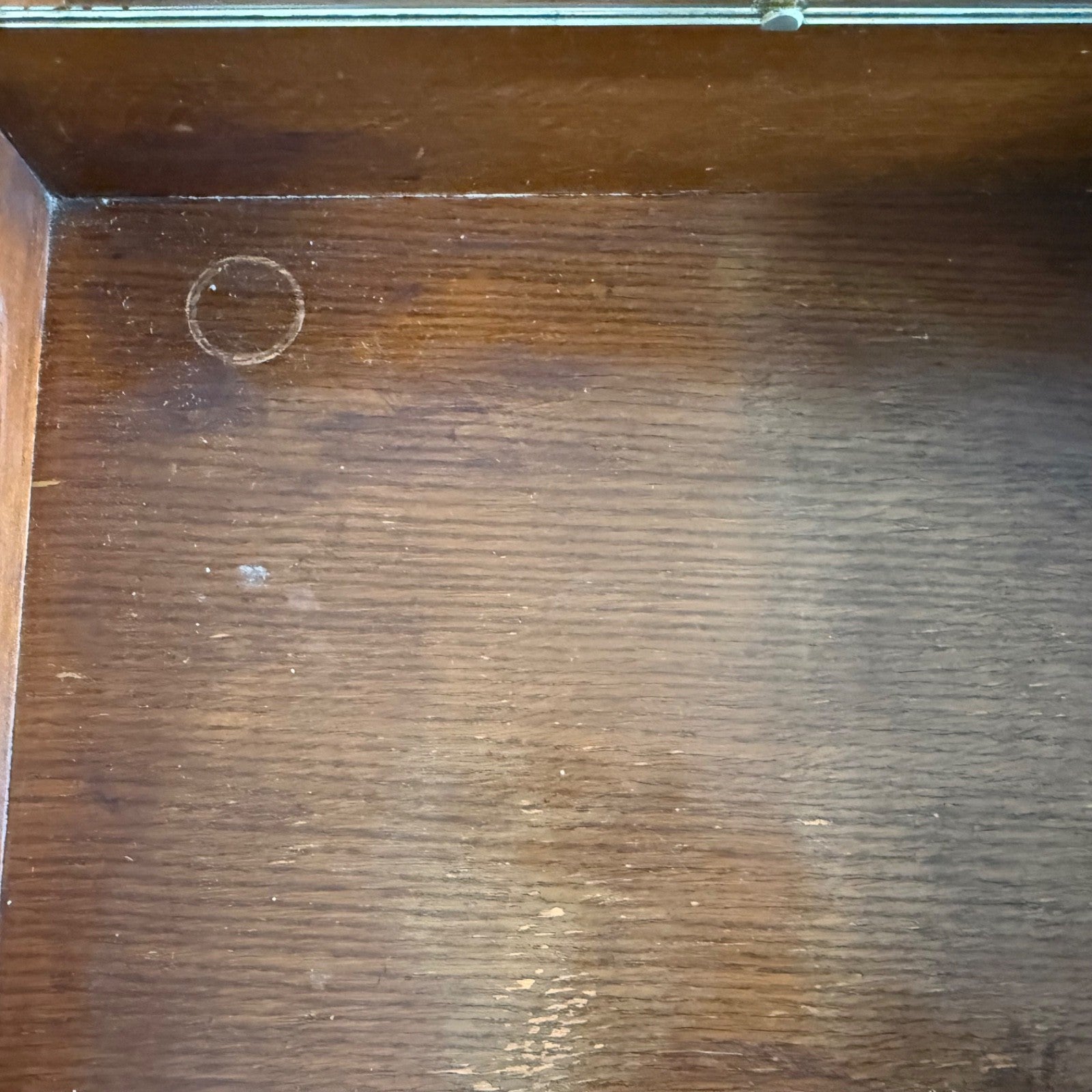 Top surface of Harris Lebus oak dressing table showing wear mark