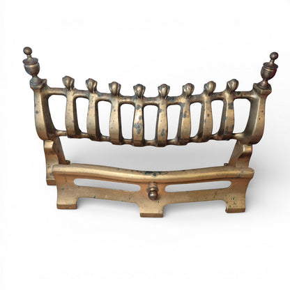 Late Victorian brass fire grate with finial uprights