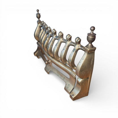 Original brass fender with Victorian fire grate