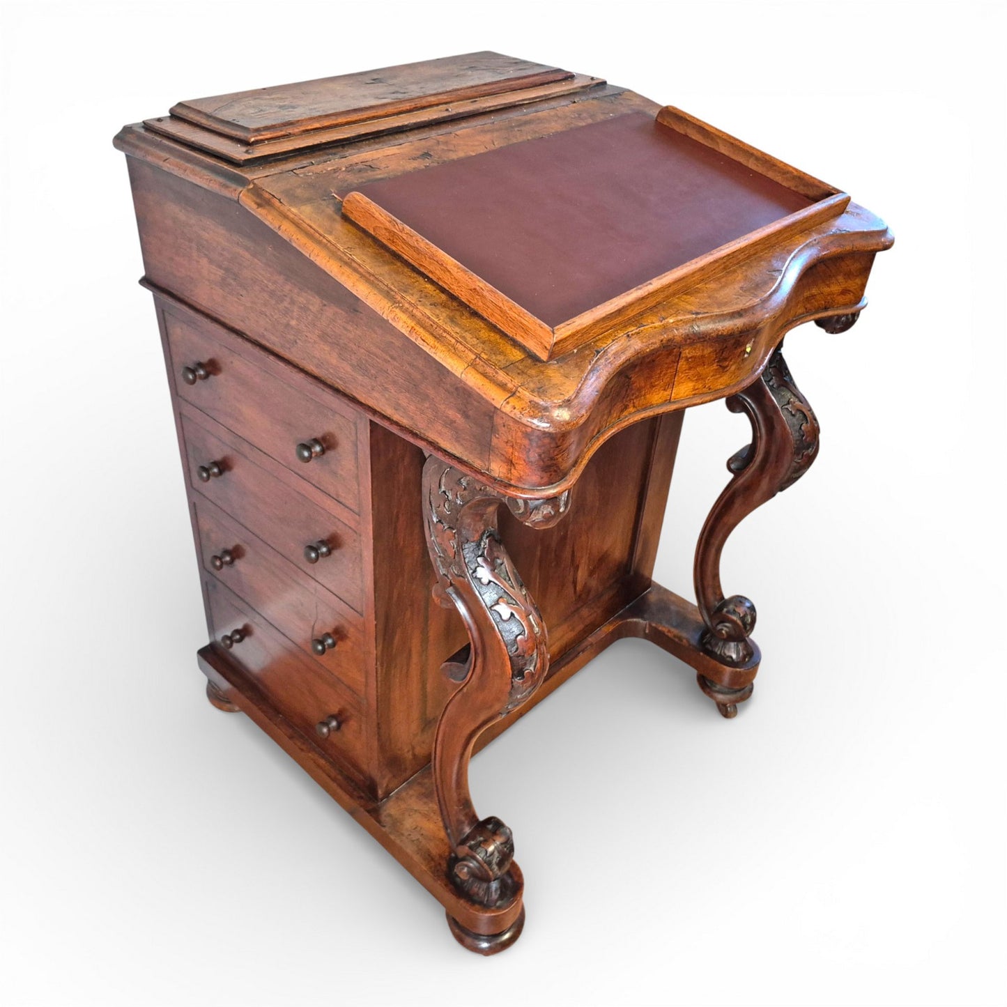 Victorian burr walnut davenport desk showing carved cabriole legs and leather writing slope