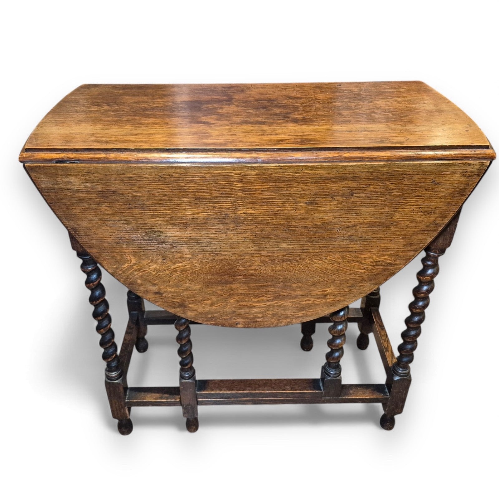 Folded Victorian gate-leg table showing compact storage size