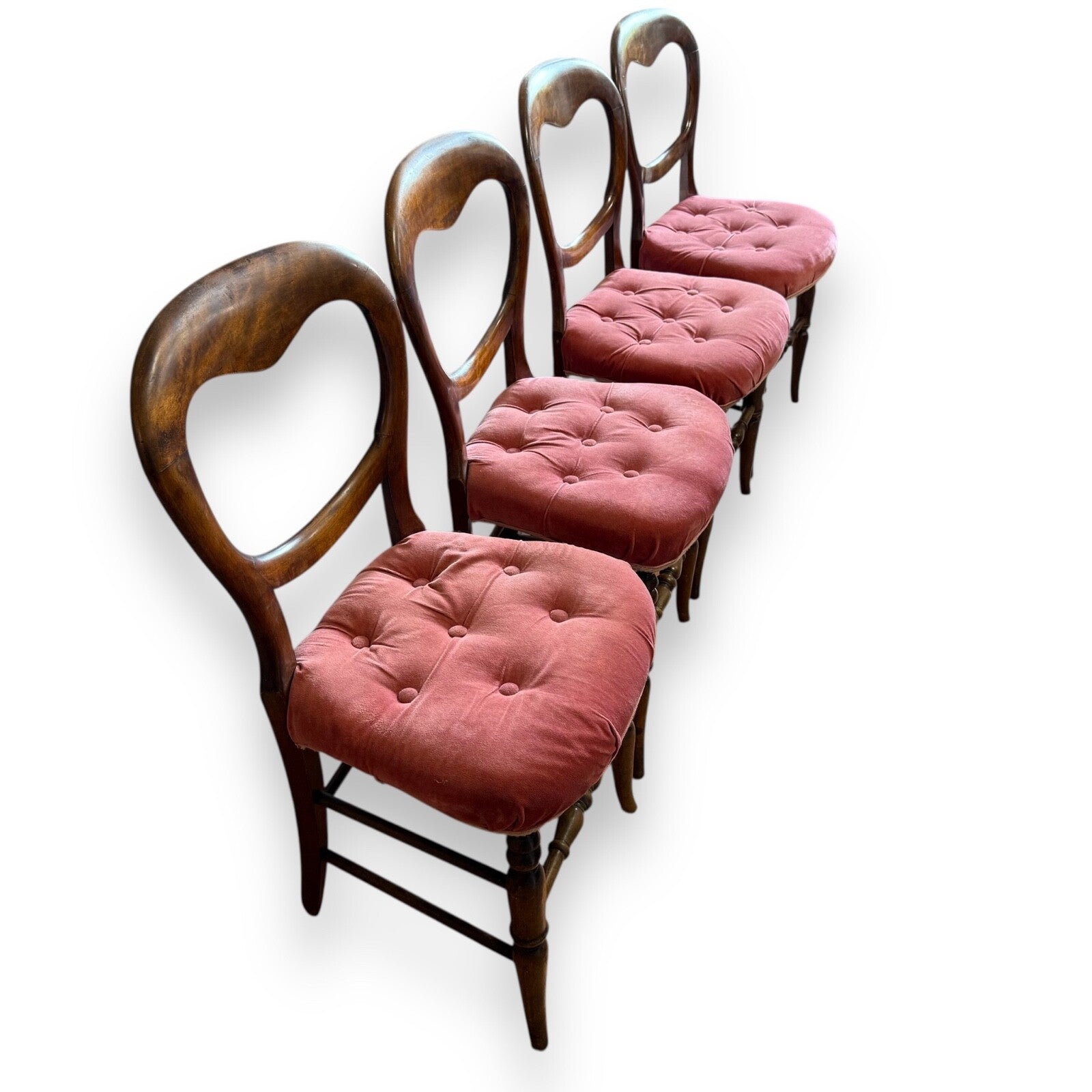 Victorian balloon back dining chairs – angled view highlighting curved frames and pink upholstery