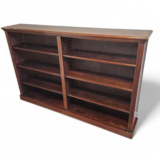 Angled view showing elegant proportions of 19th-century mahogany bookcase