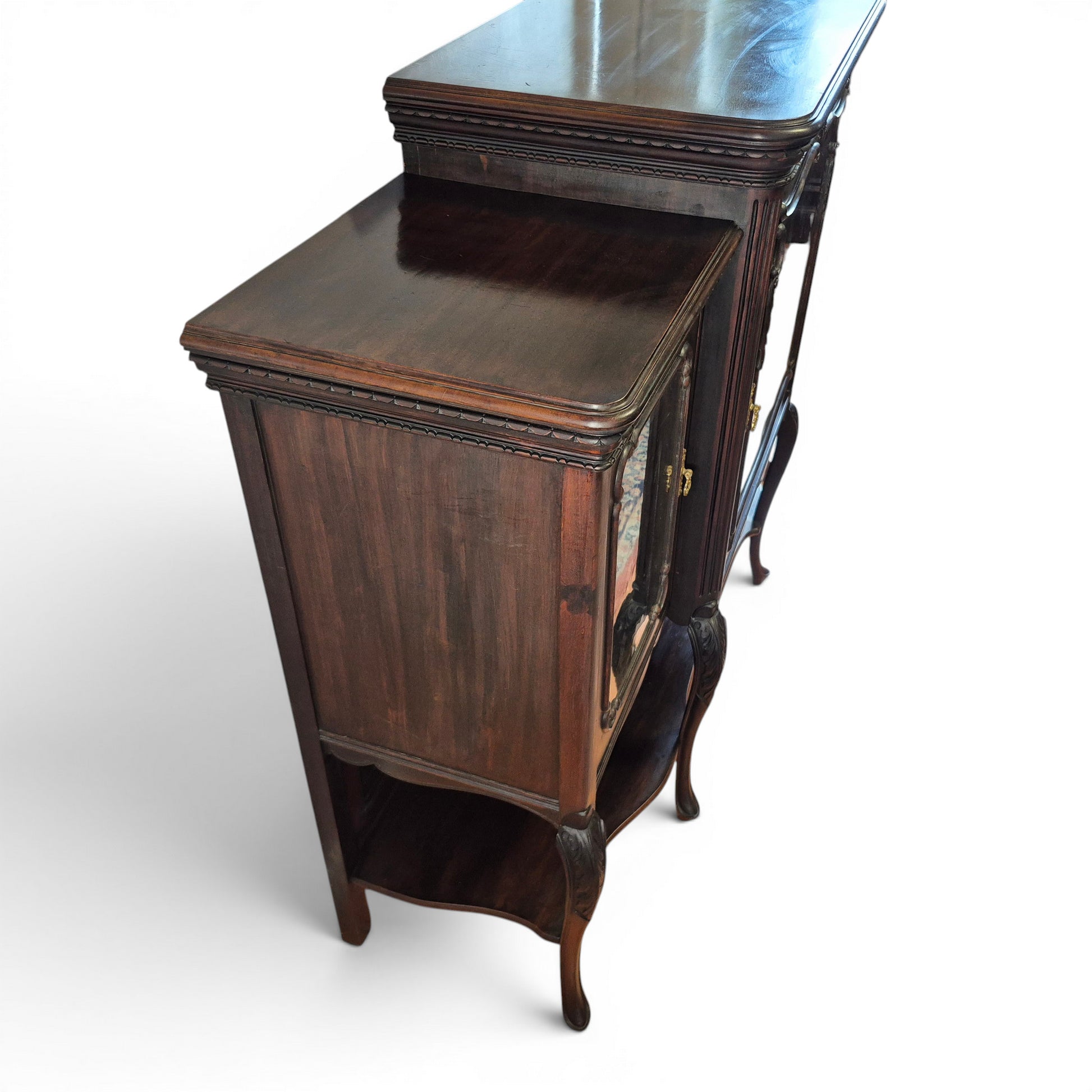 Left Side View Antique mahogany glazed cabinet with carved detailing and shaped legs