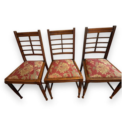 Top view of Victorian mahogany ladderback chairs showing warm wood tone and classic Arts & Crafts design