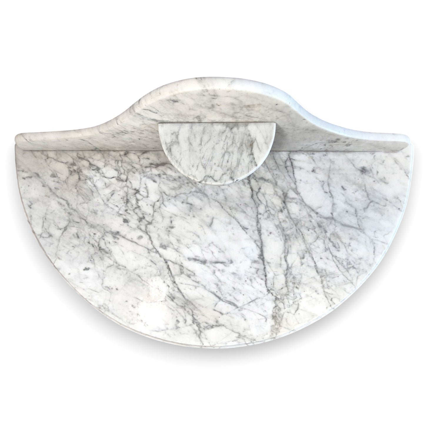 Top view of the veined marble top and shaped backstand on an antique Victorian washstand.