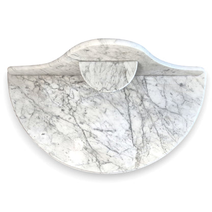 Top view of the veined marble top and shaped backstand on an antique Victorian washstand.